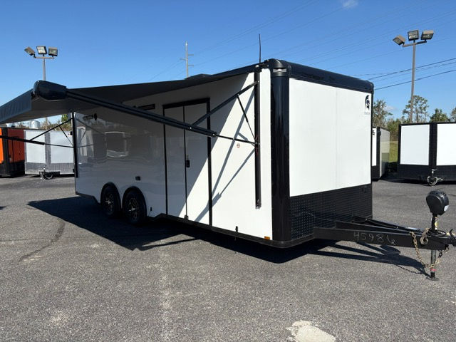 Spartan Cargo Trailers 8.5x24 white race car trailer with polycore exterior, electric awning, E-track flooring, cabinets, and generator platform for sale.