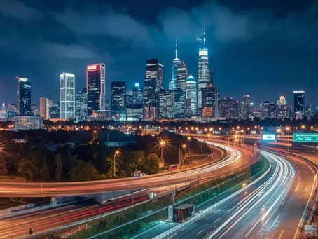A panoramic urban city view along Urban Extension Road 2 (UER II), showcasing modern residential and commercial developments, high-rise apartments, and well-planned infrastructure in Delhi.