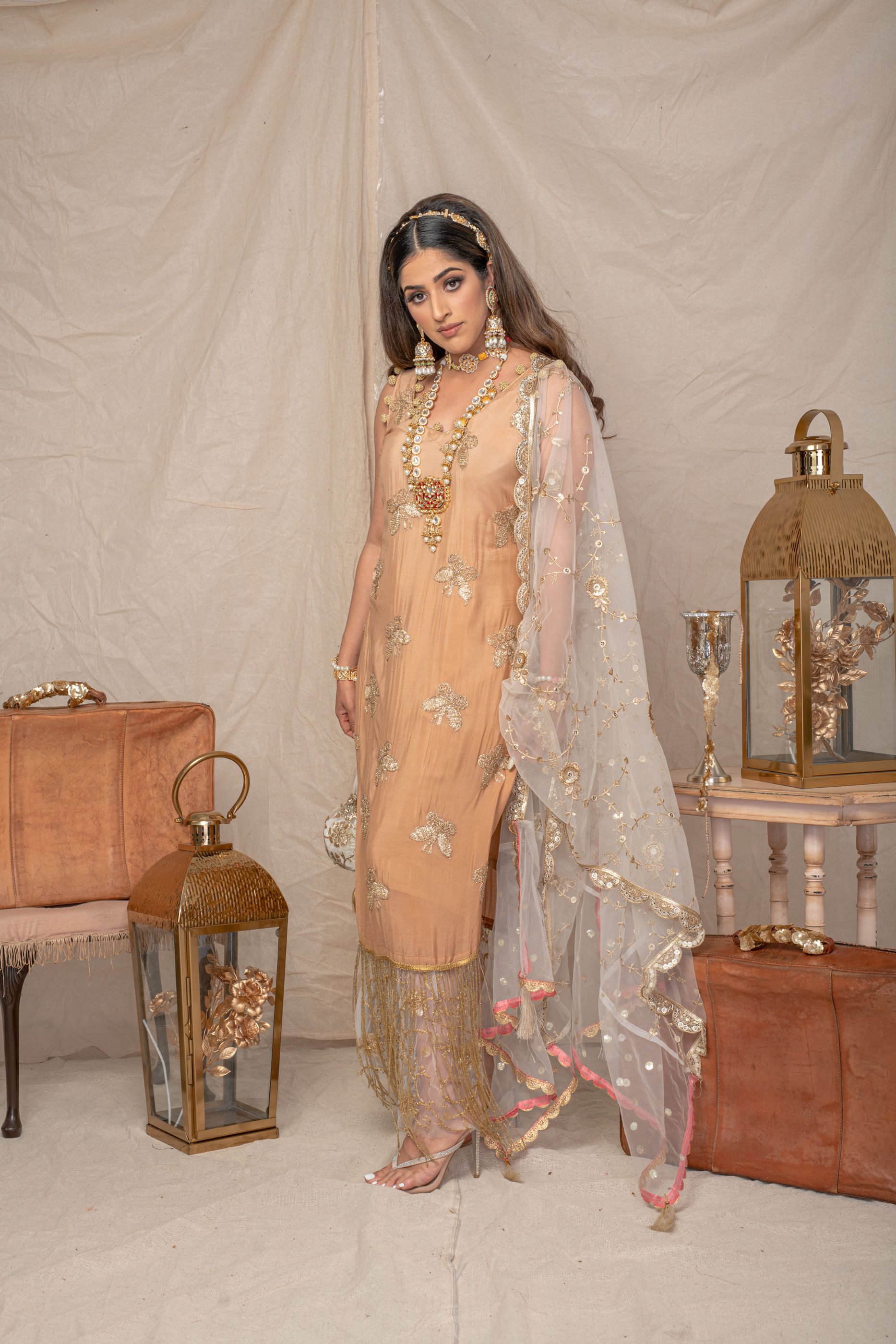 The tasselly nude brown suit + matching bag