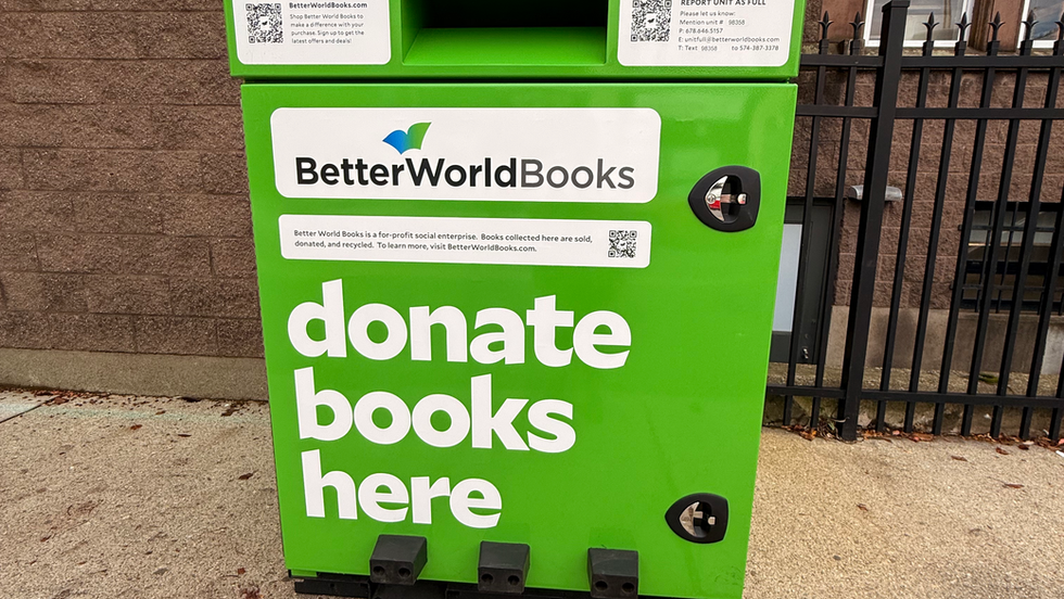 Large green container where people to donate books.