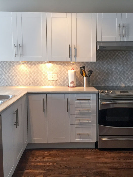 Freshly reset modern kitchen with clean countertops and styled finishes