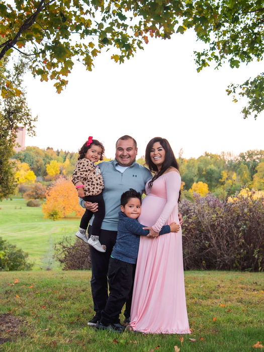 Outdoor family portrait capturing a meaningful milestone moment in Ottawa