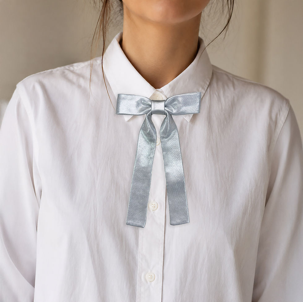 Thumbnail: Silver satin bow tie for women with long tails worn with a white shirt