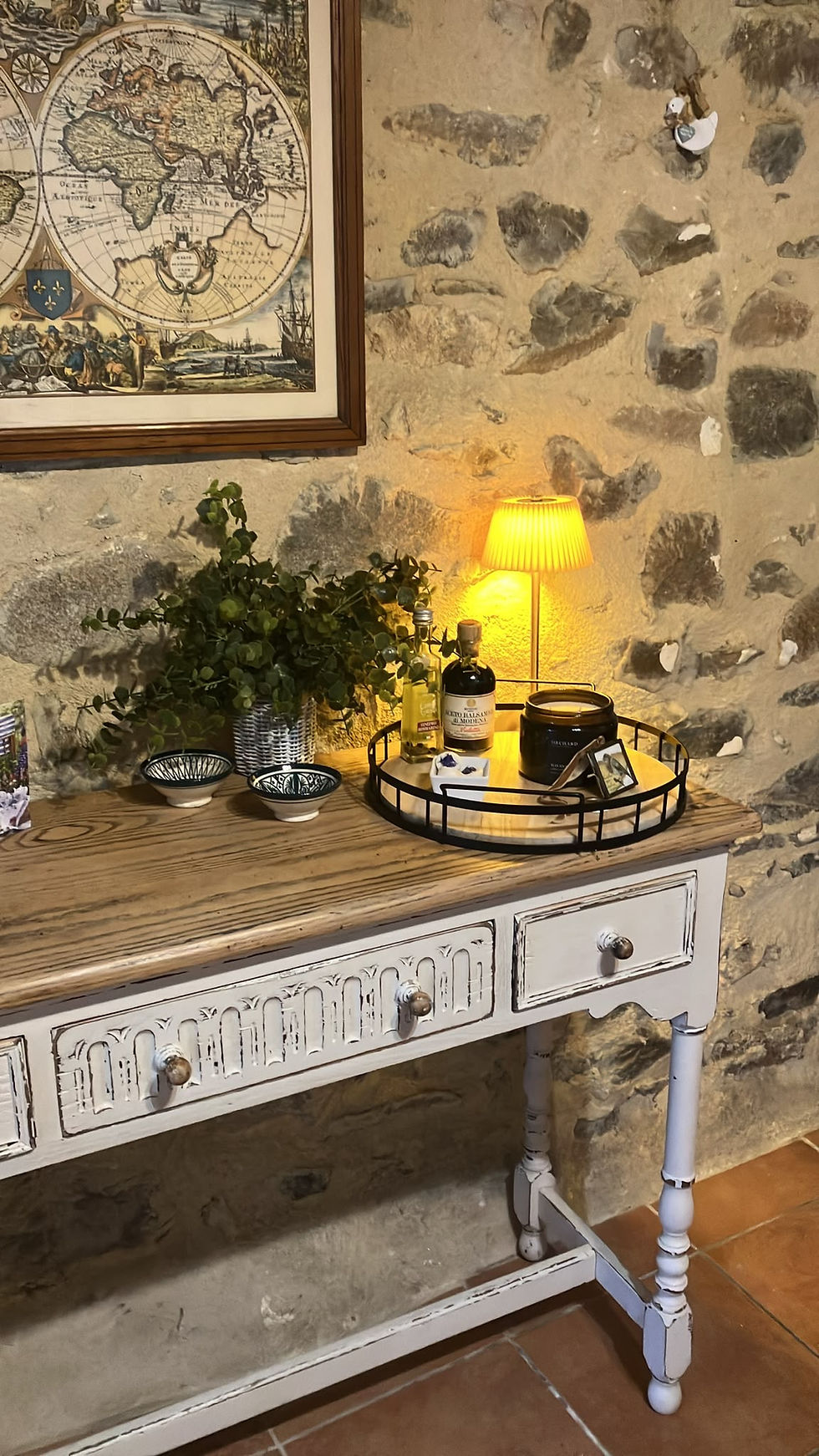 Little Messenger robin memorial keepsake displayed in its new home in a rustic stone cottage in France.