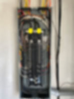 Eye-level view of electrician installing wiring in a new residential building