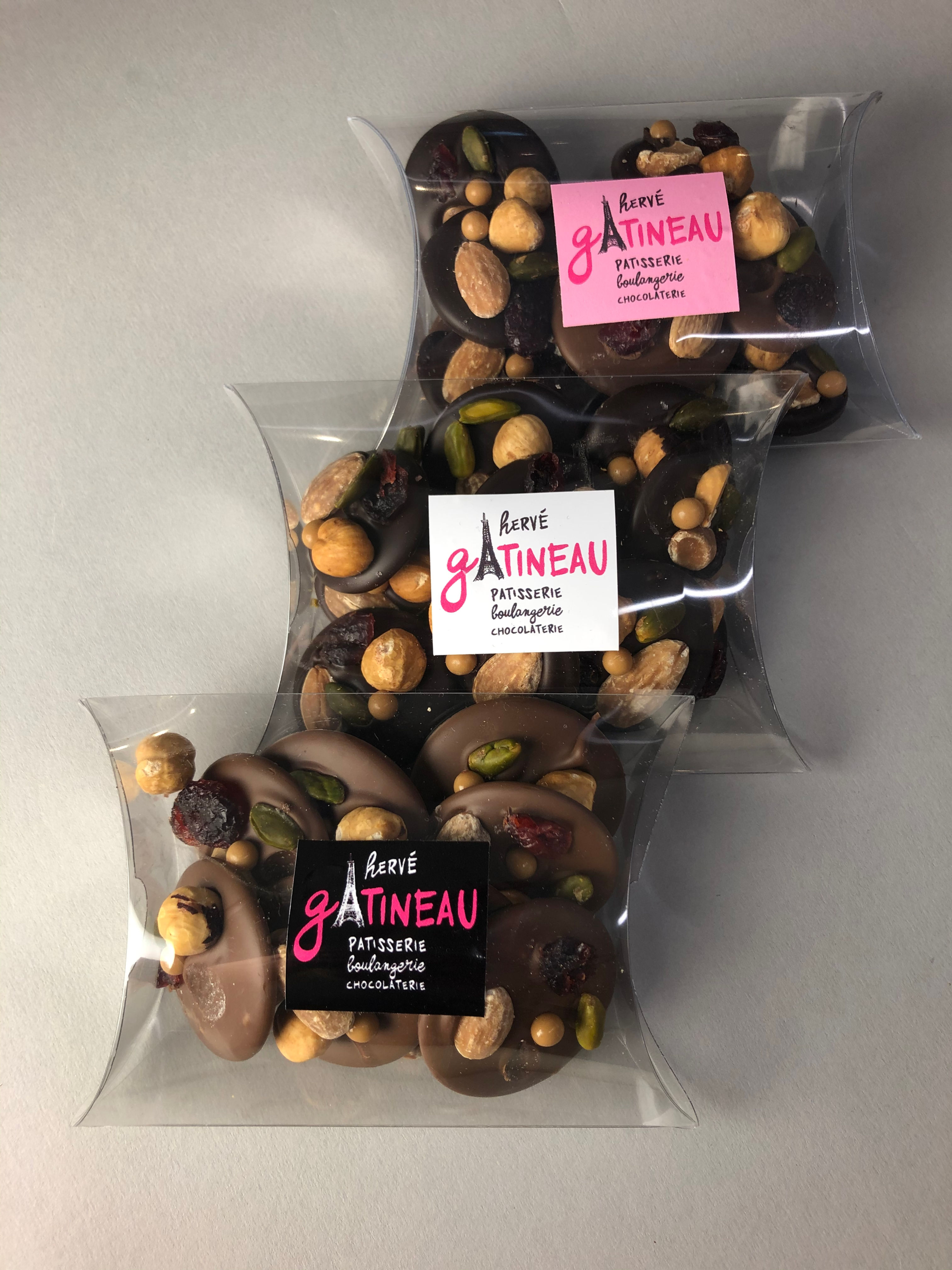 Chocolate Mendiants handmade by Gatineau - with roasted almond, pistachio, hazelnut and dried cranberry.