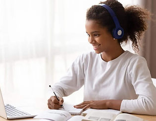happy-teen-engaging-with-a-class-and-doing-work-on-her-laptop-2.jpg