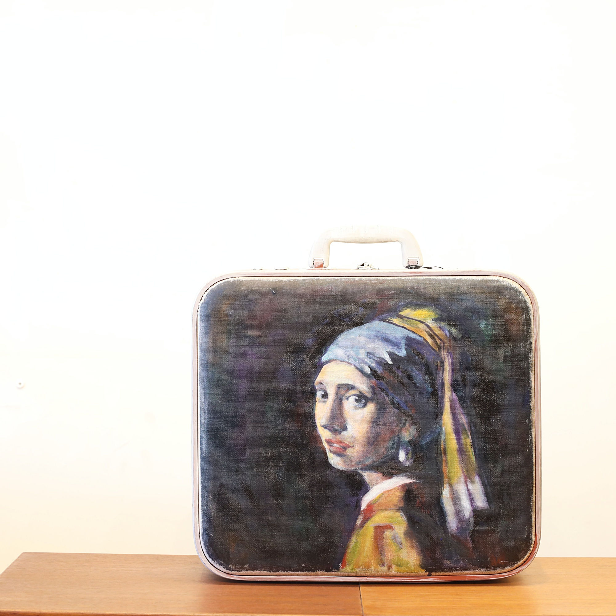 Hand painting on a vintage suitcase bag