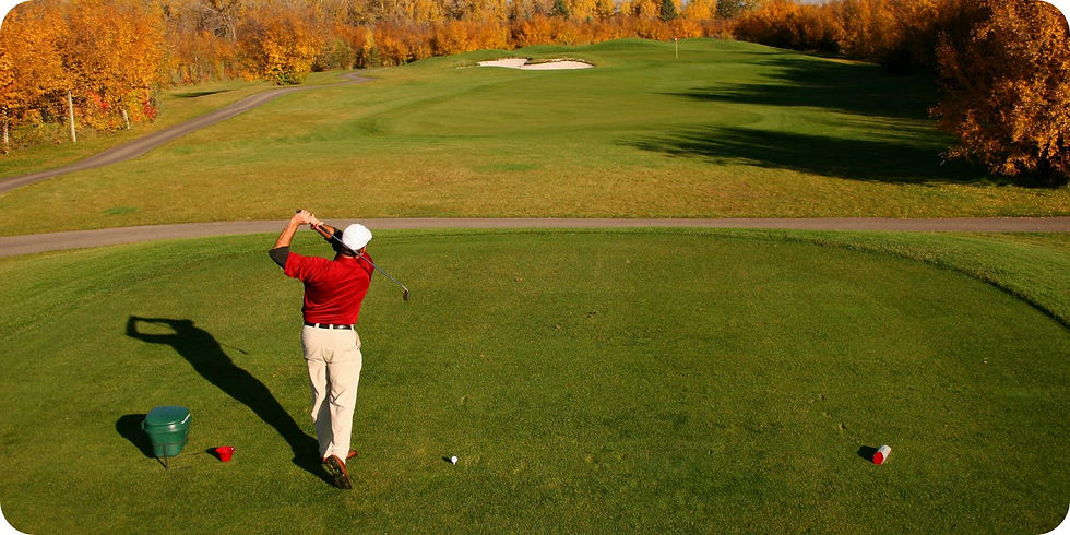 Image of a golfer teeing off at driving range.