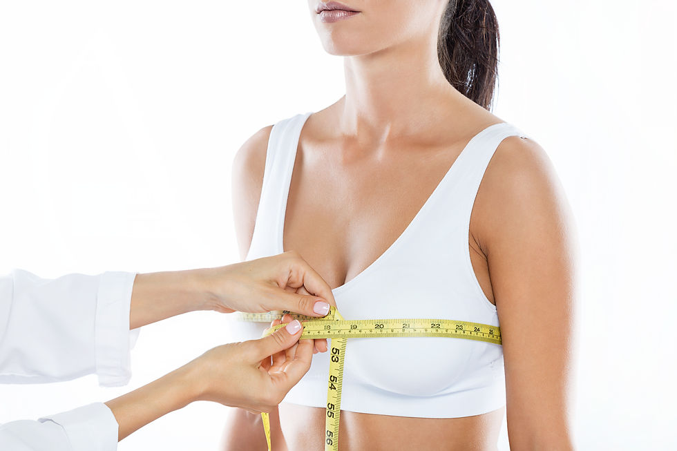 doctor-with-measure-tape-measuring-the-size-of-the-patient-s-breast.jpg