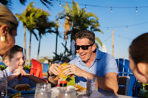 New Smyrna Beach - River Deck Tiki Bar & Restaurant - Family Eating 1 - 2025 (Roundhouse C