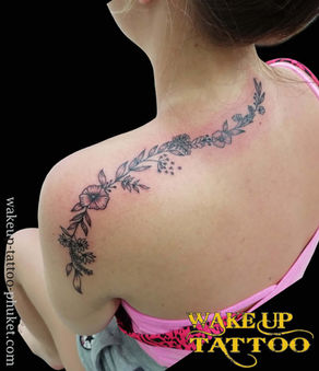 Flowers tattoo on shoulder by Wake up Tattoo Phuket