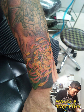 Lotus color tattoo by Wake up Tattoo Phuklet at Patong Beach Thailand