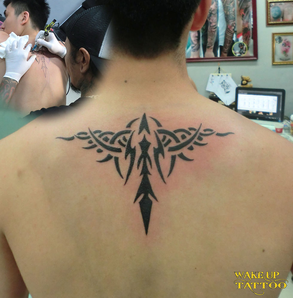 tribal tattoo by Wake up Tattoo Phuket at Patong Beach