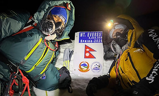 Jen with one of her guides, Phunjo Lama, on the summit of Mount Everest