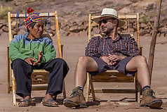 Celso and Alejandro talking on the beach of Taquile Island, Lake Titicaca, Puno, Peru