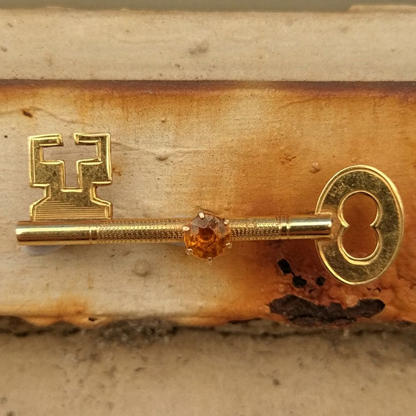 9ct 21st Birthday brooch with topaz