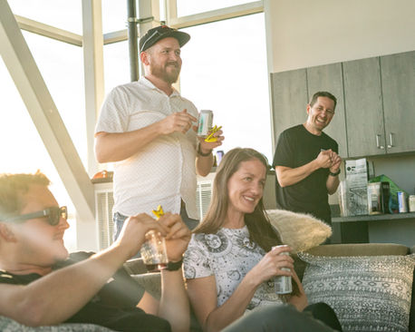 Rigeline team smiling and having drinks