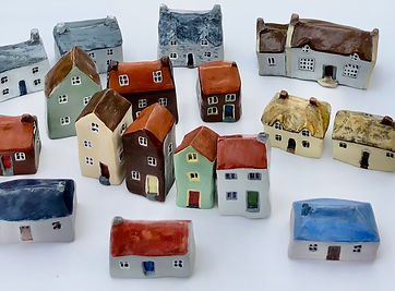 A collection of miniature clay cottages