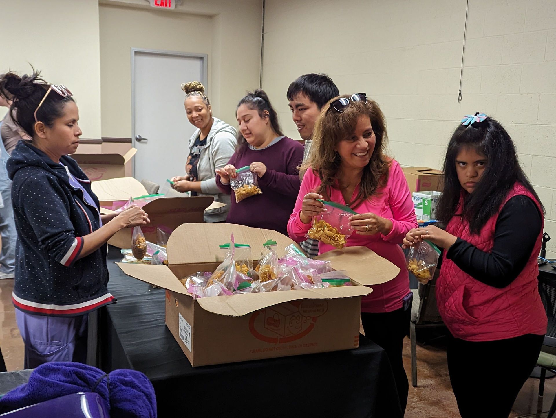 participants packing bags for the homeless