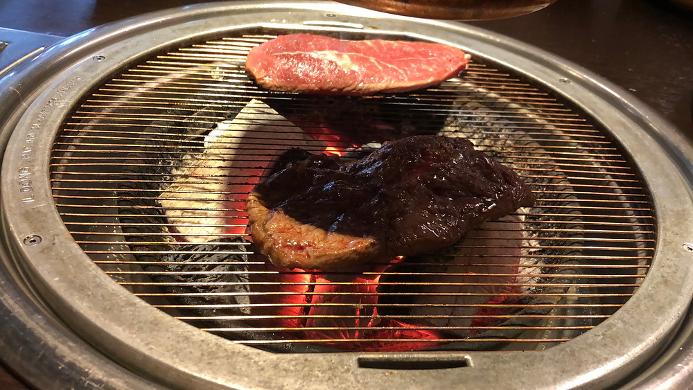 You cook Korean Barbecue in-front of you right at the table on a burner in the middle of the table