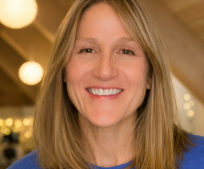 Warm smile and soft lighting.png