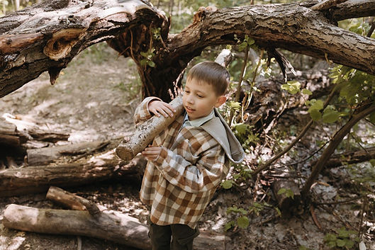7-year-old Tommy Gunderson, shown here picking his own switch, was recently diagnosed with Pediatric Asshole Disorder