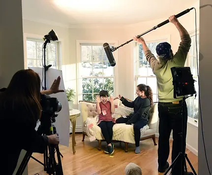 Hallmark's first transgender crew member, shown here working on a scene from Ghostly Grandma Mysteries: The Case of the Grindr Gunman