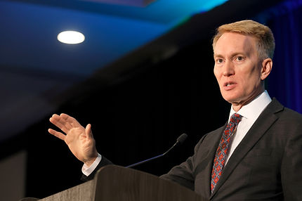 Senator Lankford, shown here reassuring homeless LGBTQ+ Americans that the flames of Hell will keep them warm for eternity