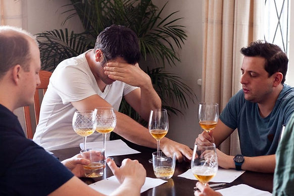 Wine lover Hanz Jacobson, shown here participating in a blinded tasting with friends and mere seconds before the tragic murder-suicide that would tear this quiet neighborhood apart at the seams
