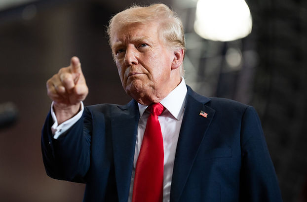 Trump, shown here pointing to the back of the room before asking the audience if they can also see the old woman that has been slowly following him wherever he goes