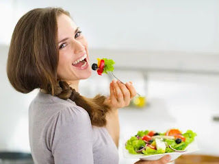 A human woman, shown here eating a salad full of seed oils and screaming helplessly into the void while cursing a God that would create such an evil substance