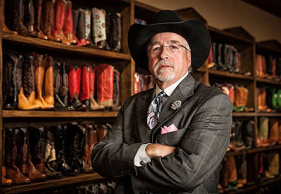 NCBA president Eisele, shown here with his collection of Wellington boots while wearing his signature bowler hat