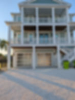 Modern glass garage door install on beach house
