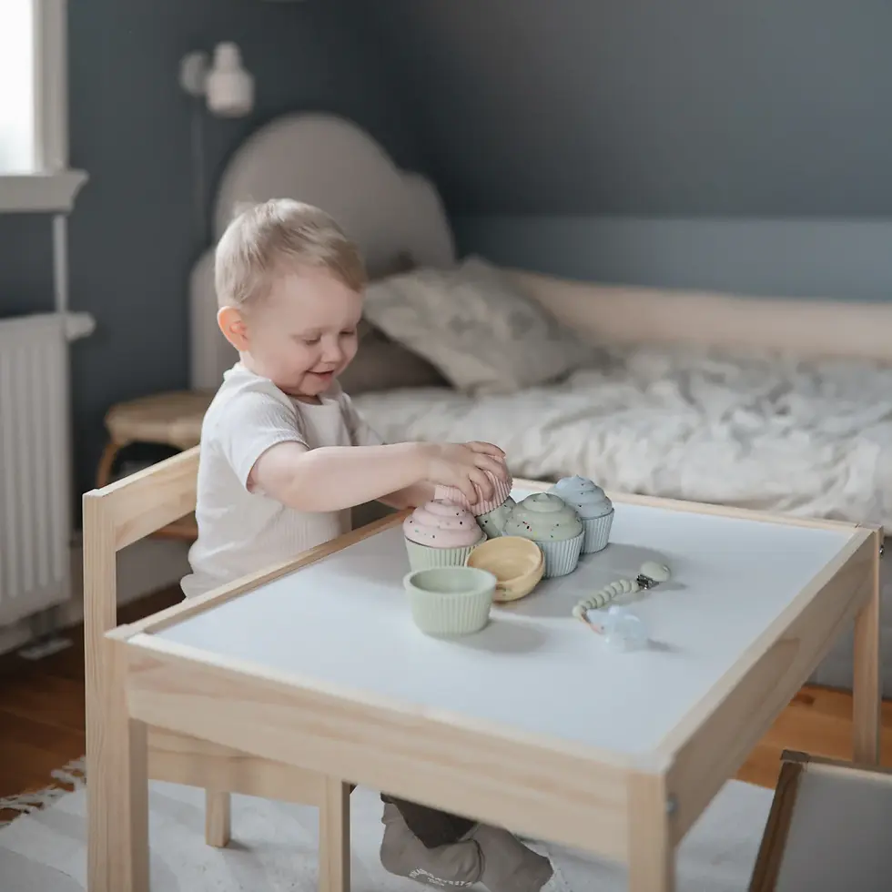 child playing with cupcake toy