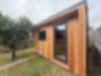 Modern wooden garden gym building with glass door in Sussex