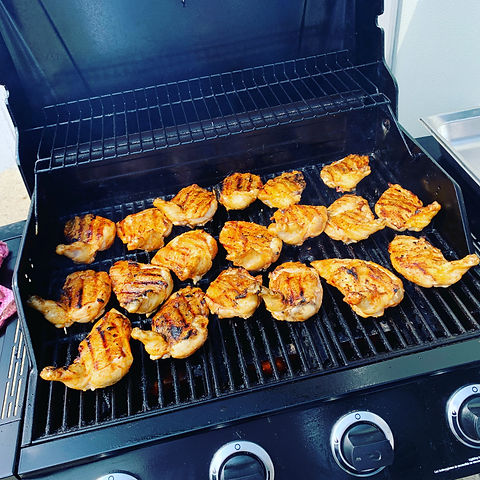 Chef grilling chicken