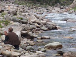 A village man shaving by the creek