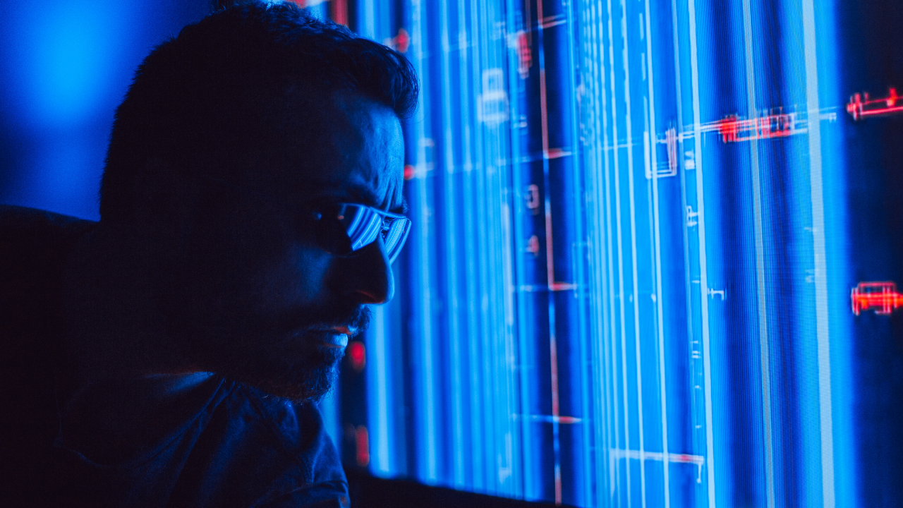 Man analyzing digital data streams, representing AI-powered enterprise apps in action.