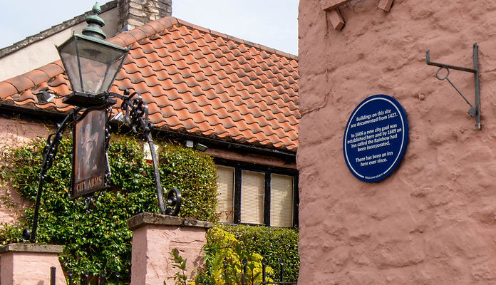 The blue plaque outside The City Arms in Wells