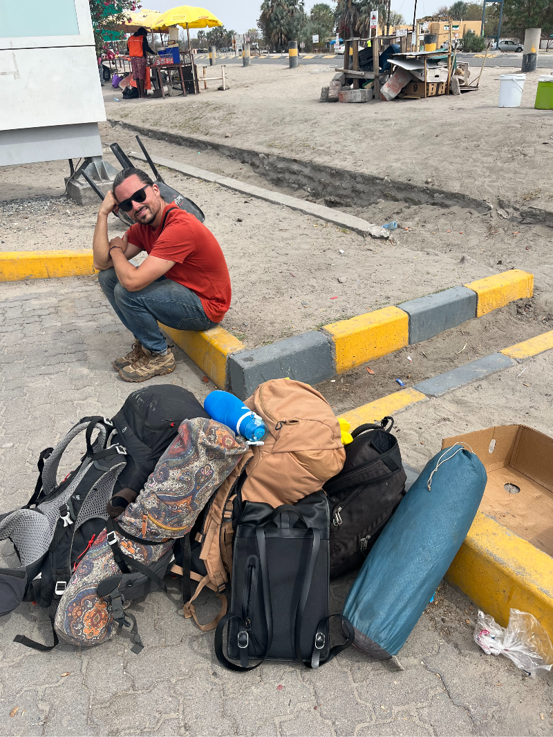 A backpacker waiting for the bus in Botswana