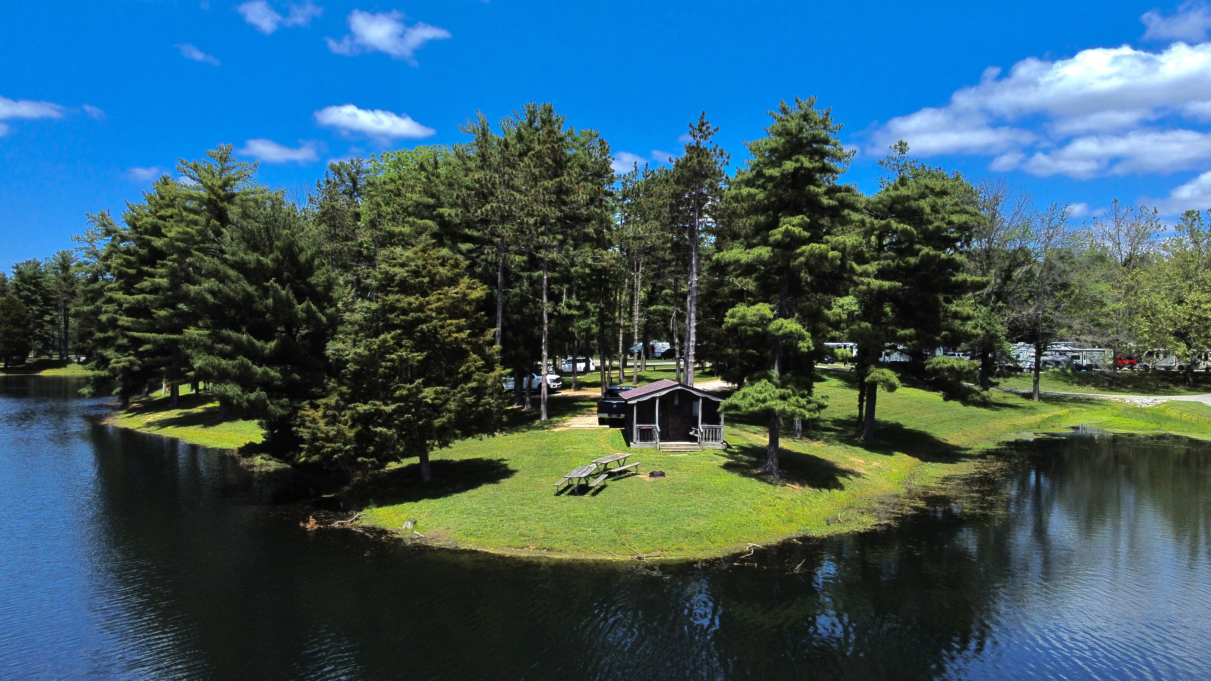 Aerial Shot of Cabin 1 at CERA on the peninsula of the lake.