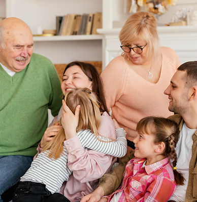 medium-shot-happy-family-couch_edited.jpg