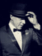 Frank-In-Person-holdin-hat-high-res-scaled.jpg