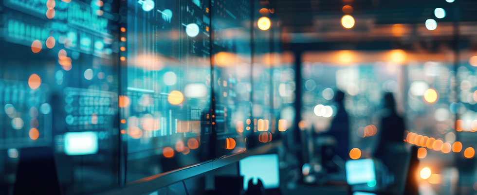 A blurry IT environment with computer monitors