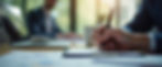 Close-up view of a person taking notes during a program management training session