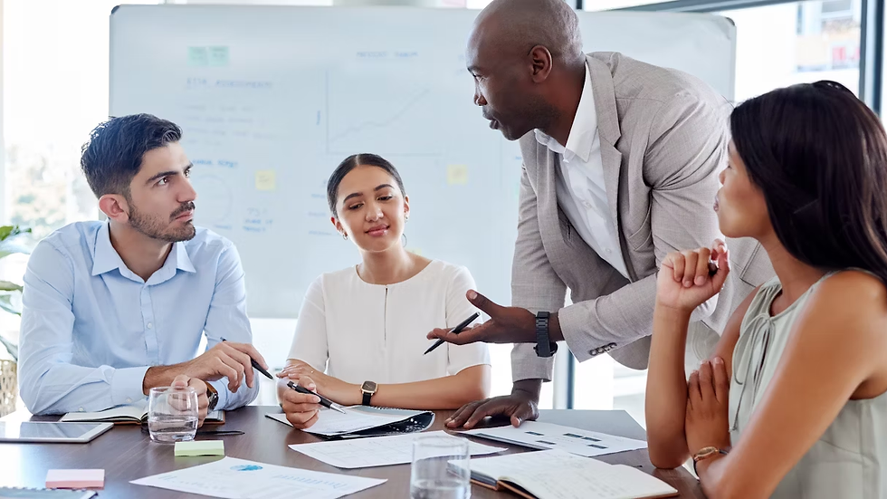 Business people talking at a table.