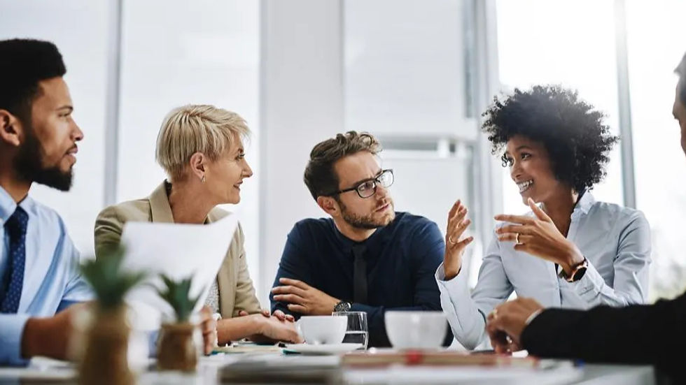 Business people talking at a table.