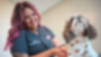 Photo of a vet take care of a puppy