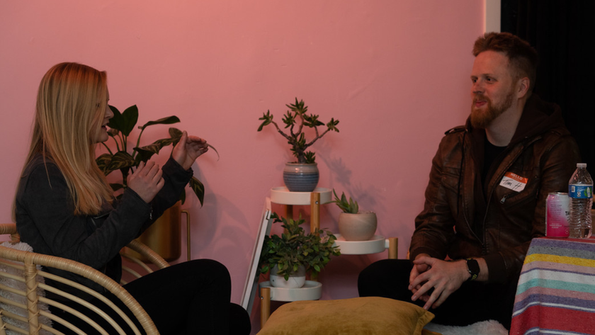 A couple young professionals talking at a Christian Speed Dating event